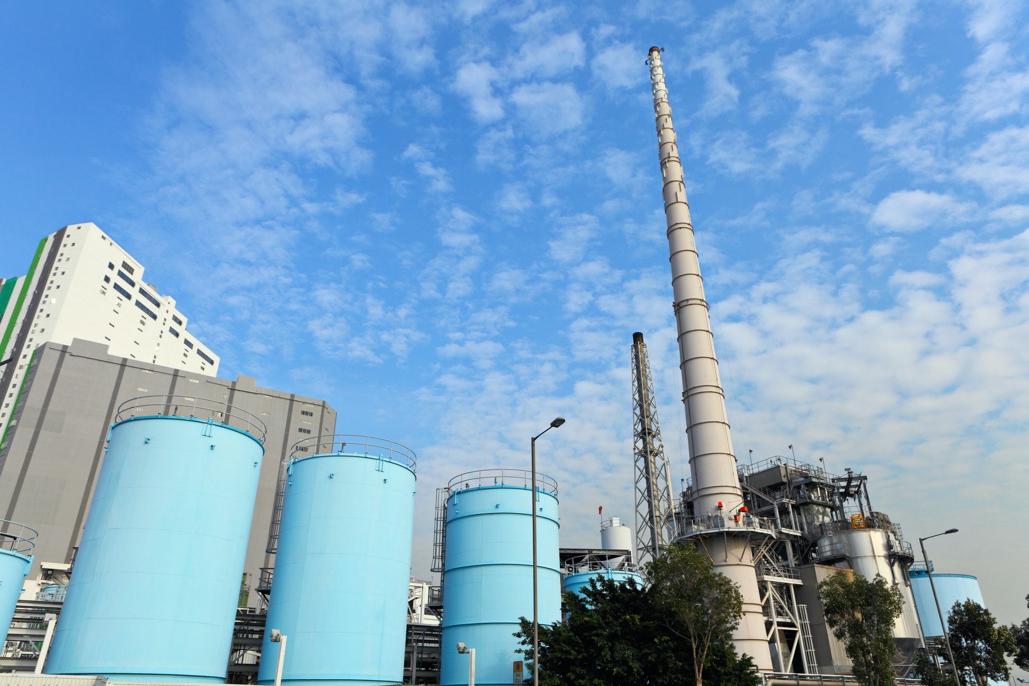 Cement and process plant with silos and stack