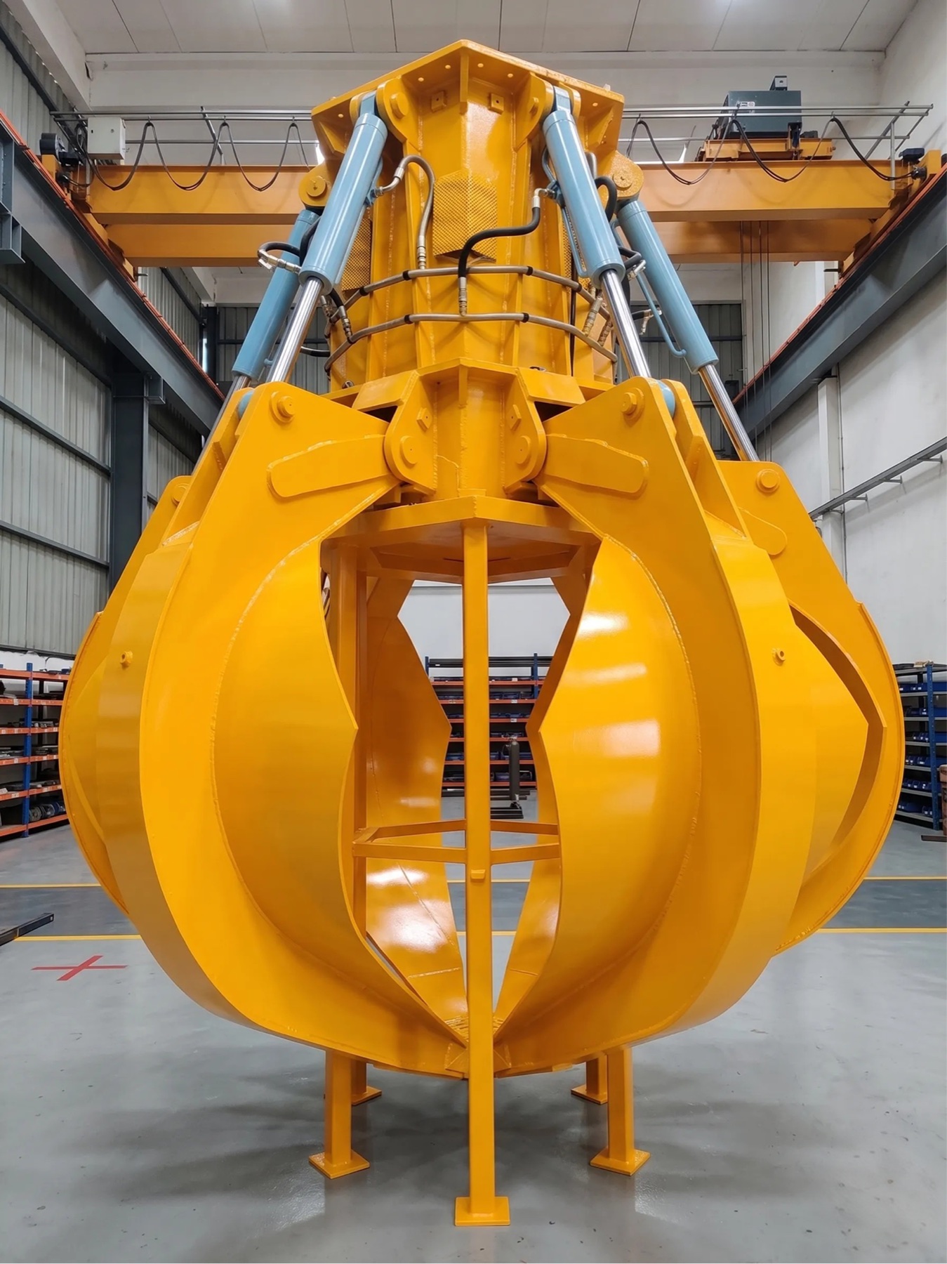 Hydraulic grab in operation at a bulk material handling facility